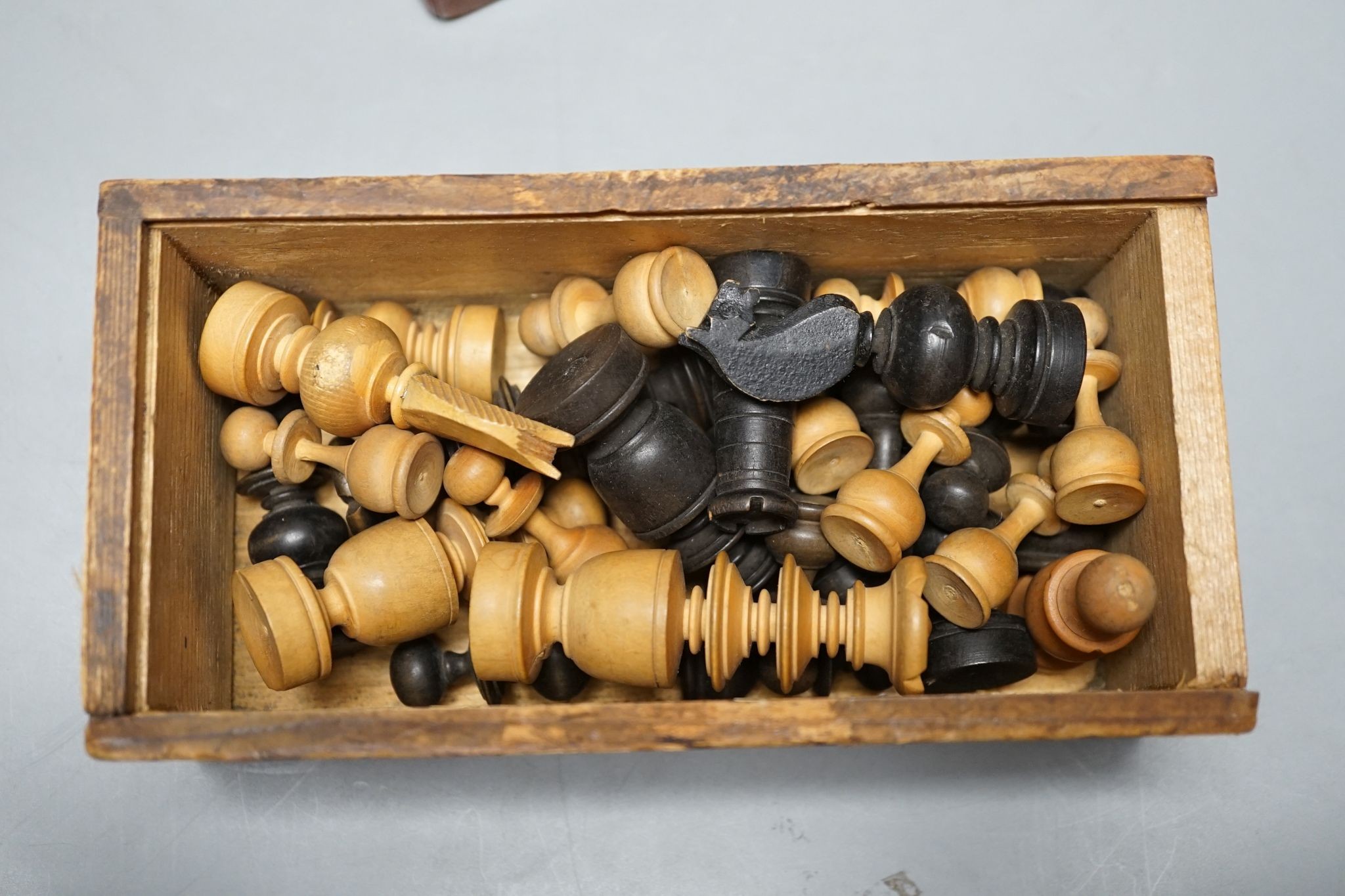 Two boxed chess sets, one turned wood, the other bone